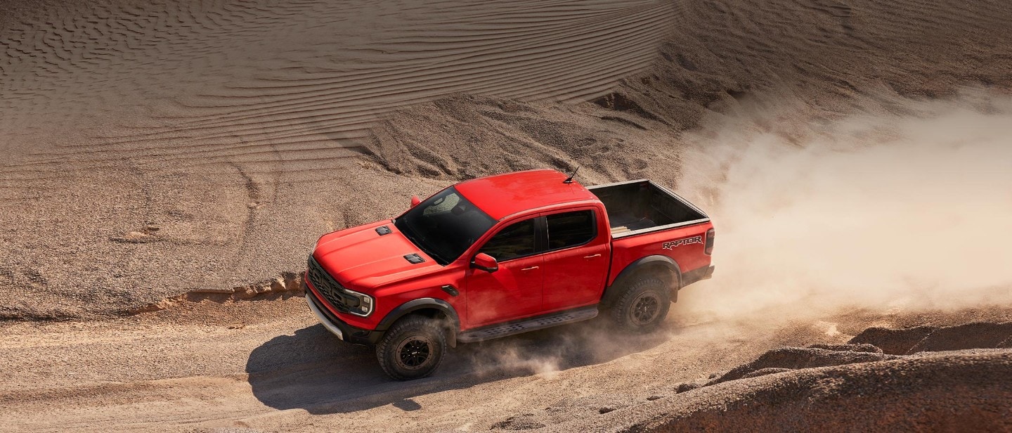 Ford Ranger side view driving rocky terrain