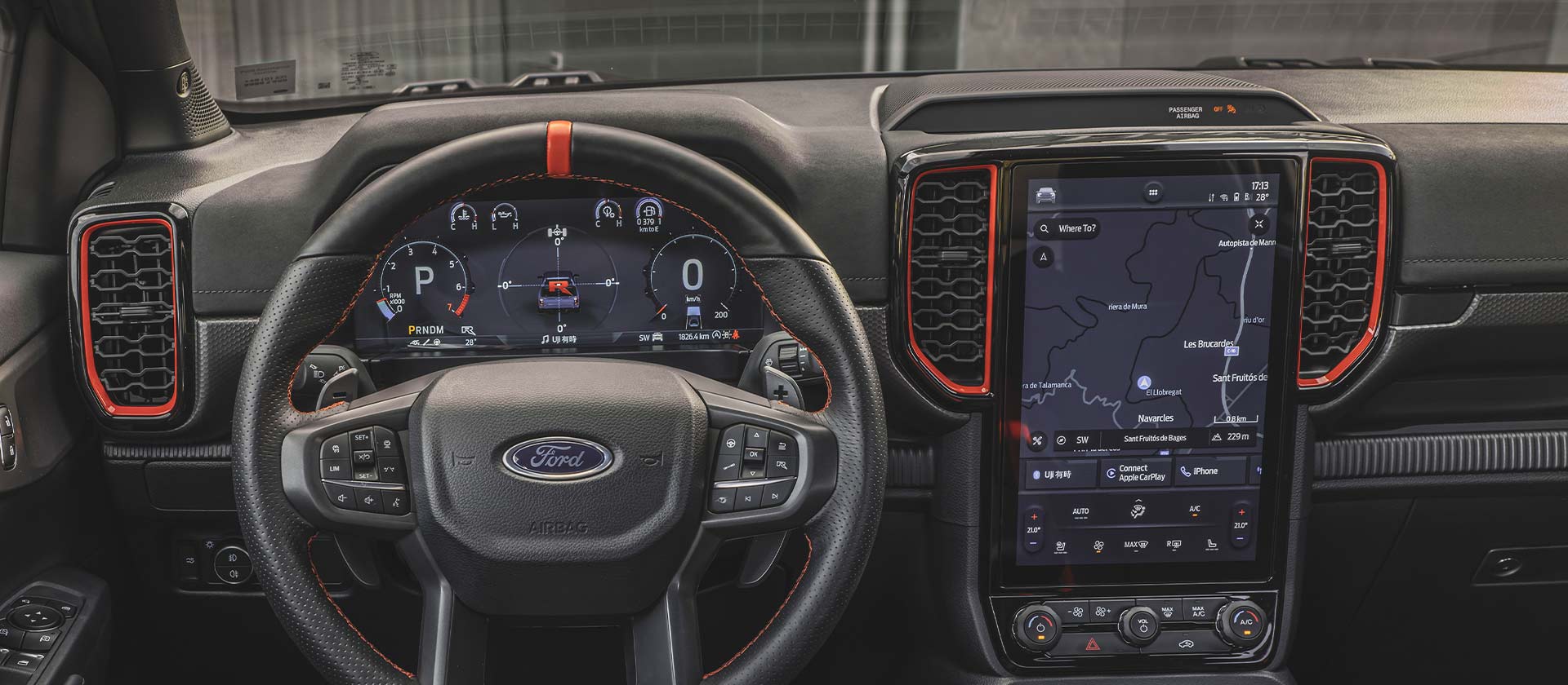 Interior view of Ford Ranger Raptor dashboard and infotainment screen.