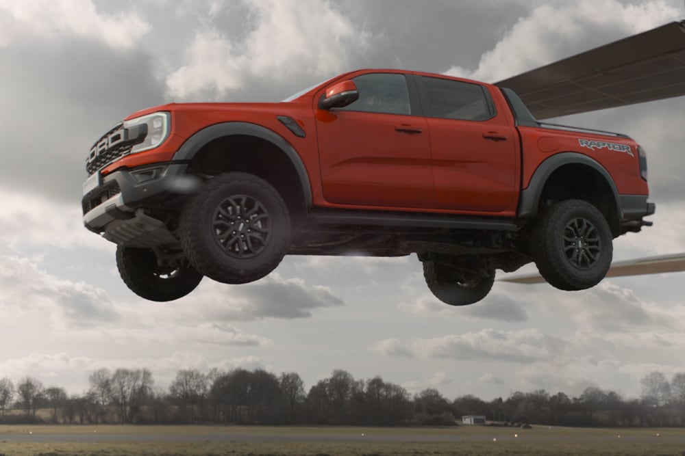Red Ford Ranger Raptor suspended in the air.