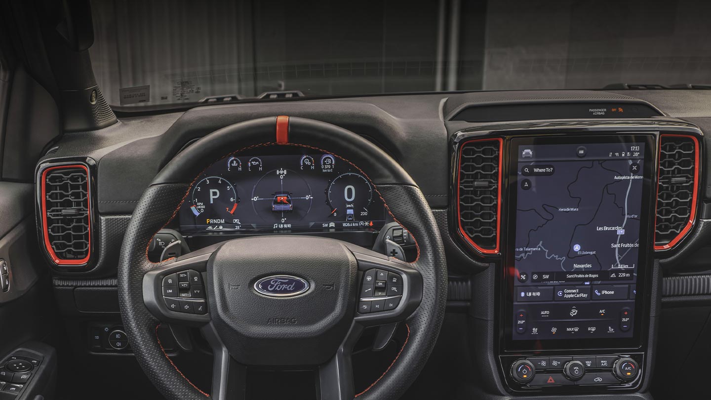 Interior view of Ford Ranger Raptor dashboard and infotainment screen.