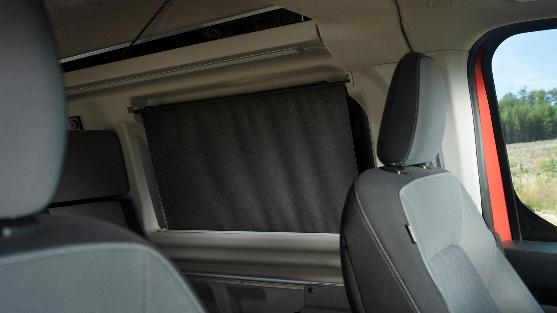 Ford Transit Custom Nugget interior with roller blackout blinds in rear windows.