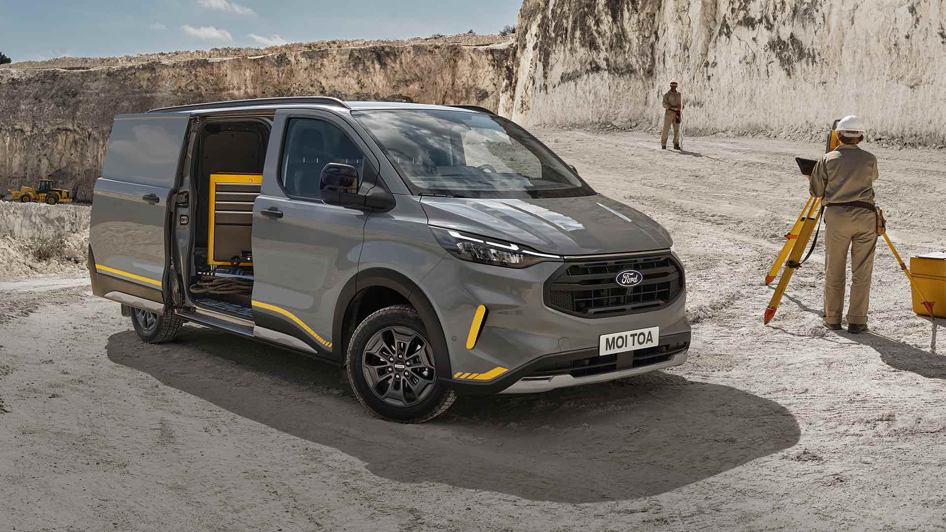 Grey Ford Transit Custom Trail van at a quarry.