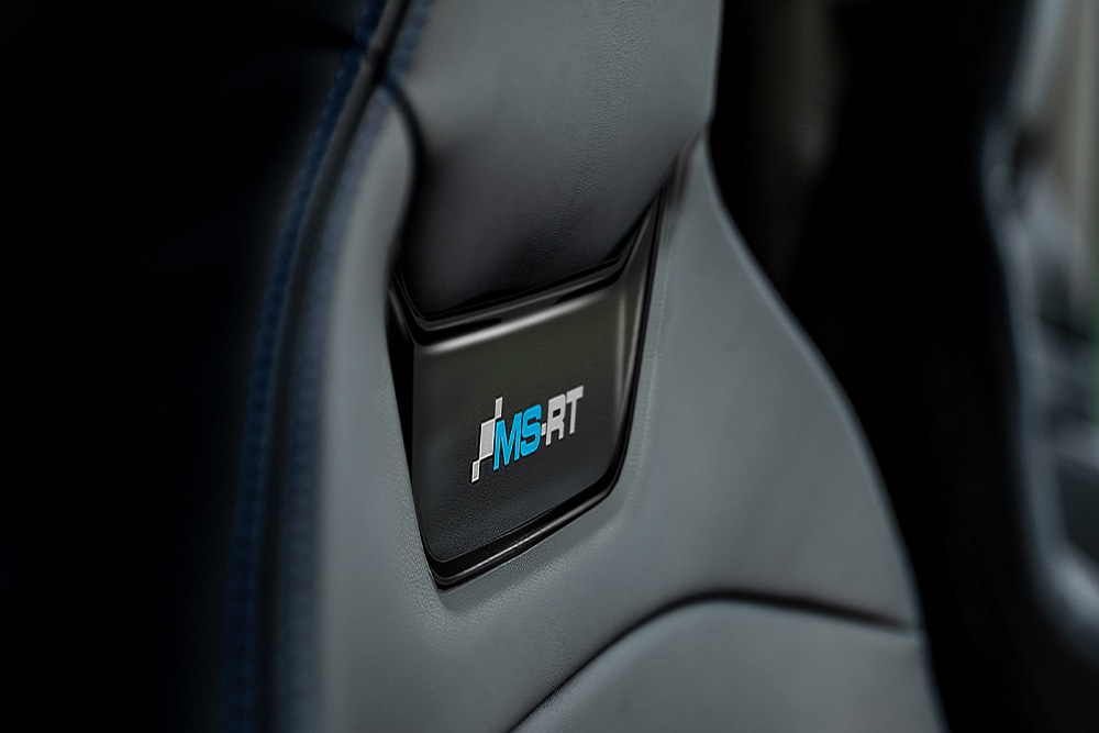 Close-up of an MS-RT logo on a car seat.