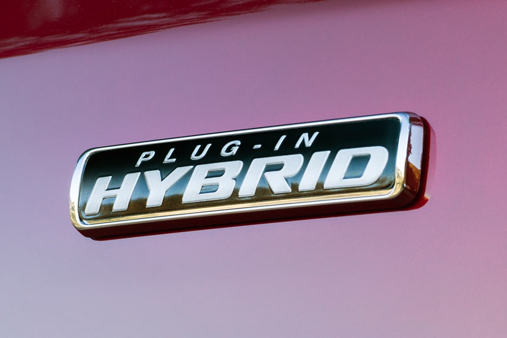 "Plug-in Hybrid" badge on a red Ford Transit Custom.