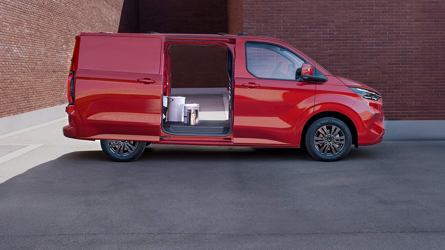 Red Ford Transit Custom van with open doors, showing interior.