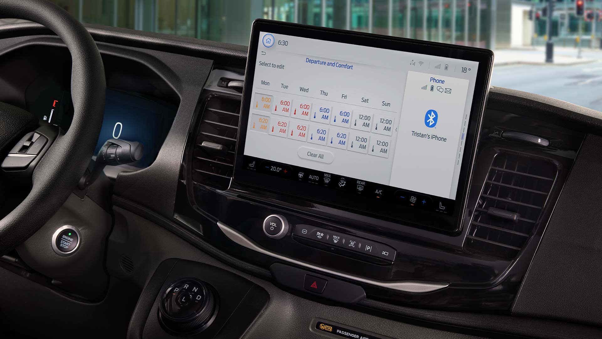 Close-up of a Ford Transit's infotainment screen, showing a schedule and phone connectivity options.