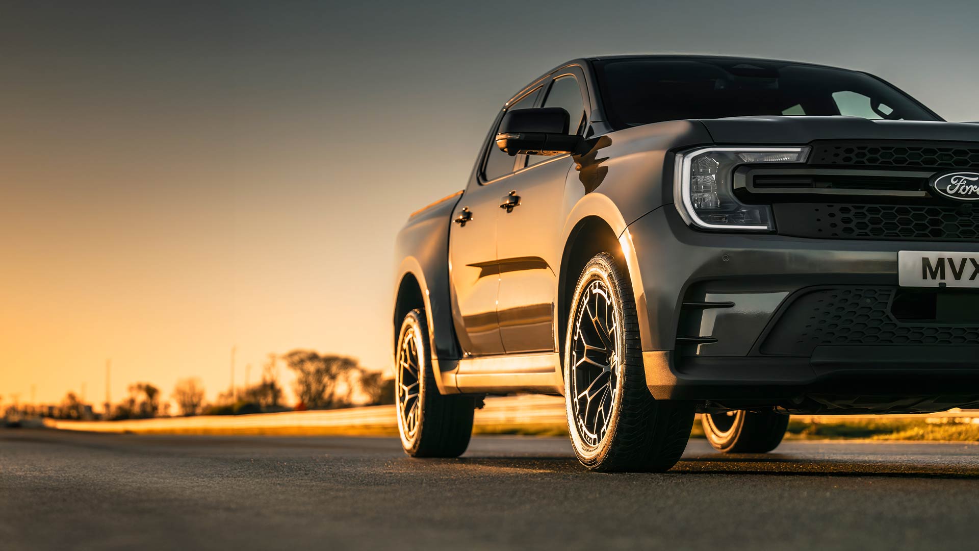 Ford Ranger MS-RT driving on a track at dusk.