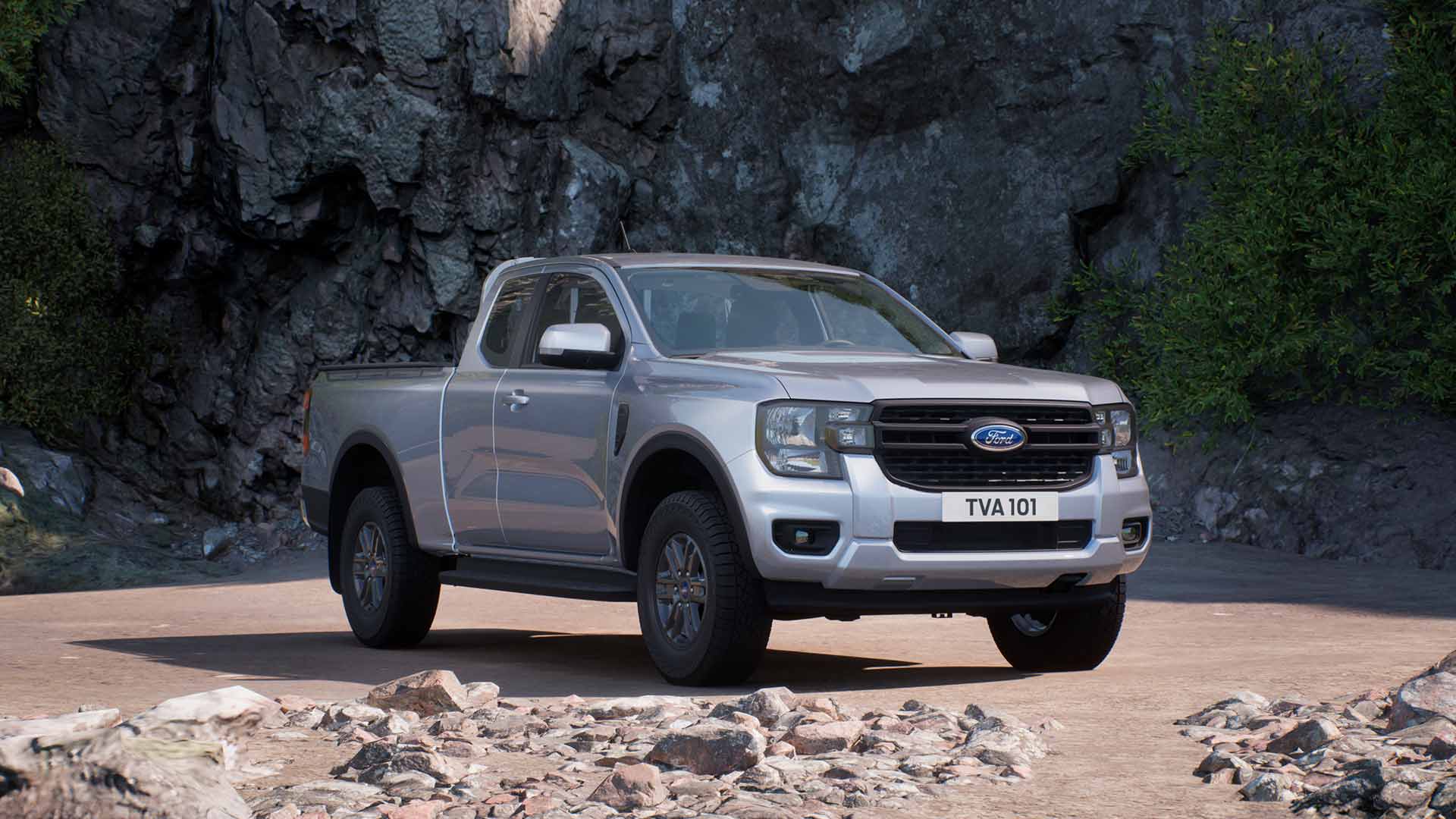 Silver Ford Ranger Super Cab XLT parked in rocky terrain.