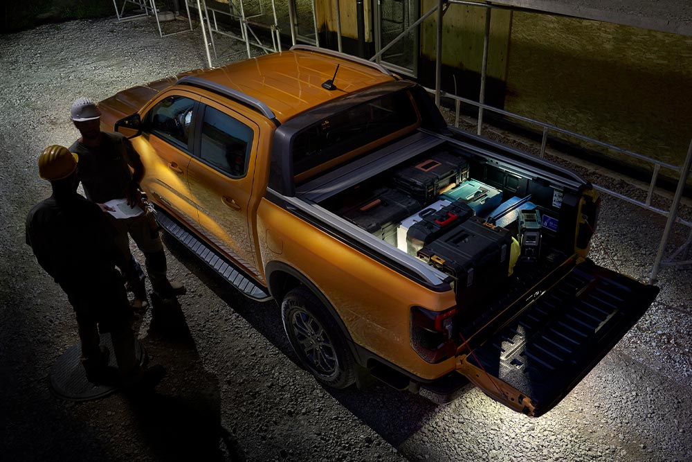Overhead view of the yellow Ford Ranger Wildtrak at night featuring exterior zone lighting.
