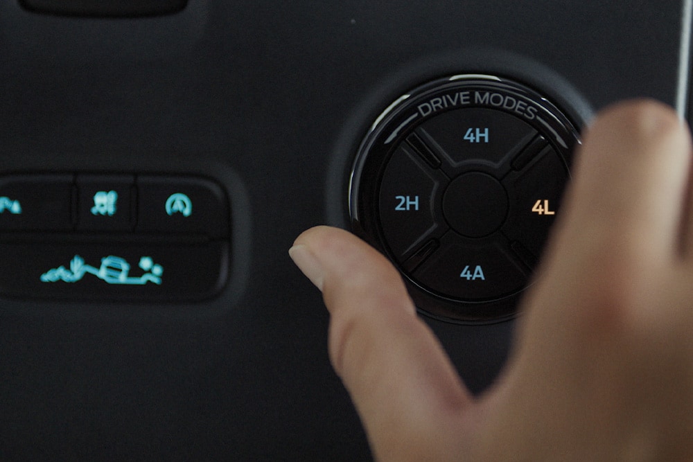  A hand selects a drive mode on the Ford Ranger's selector dial.