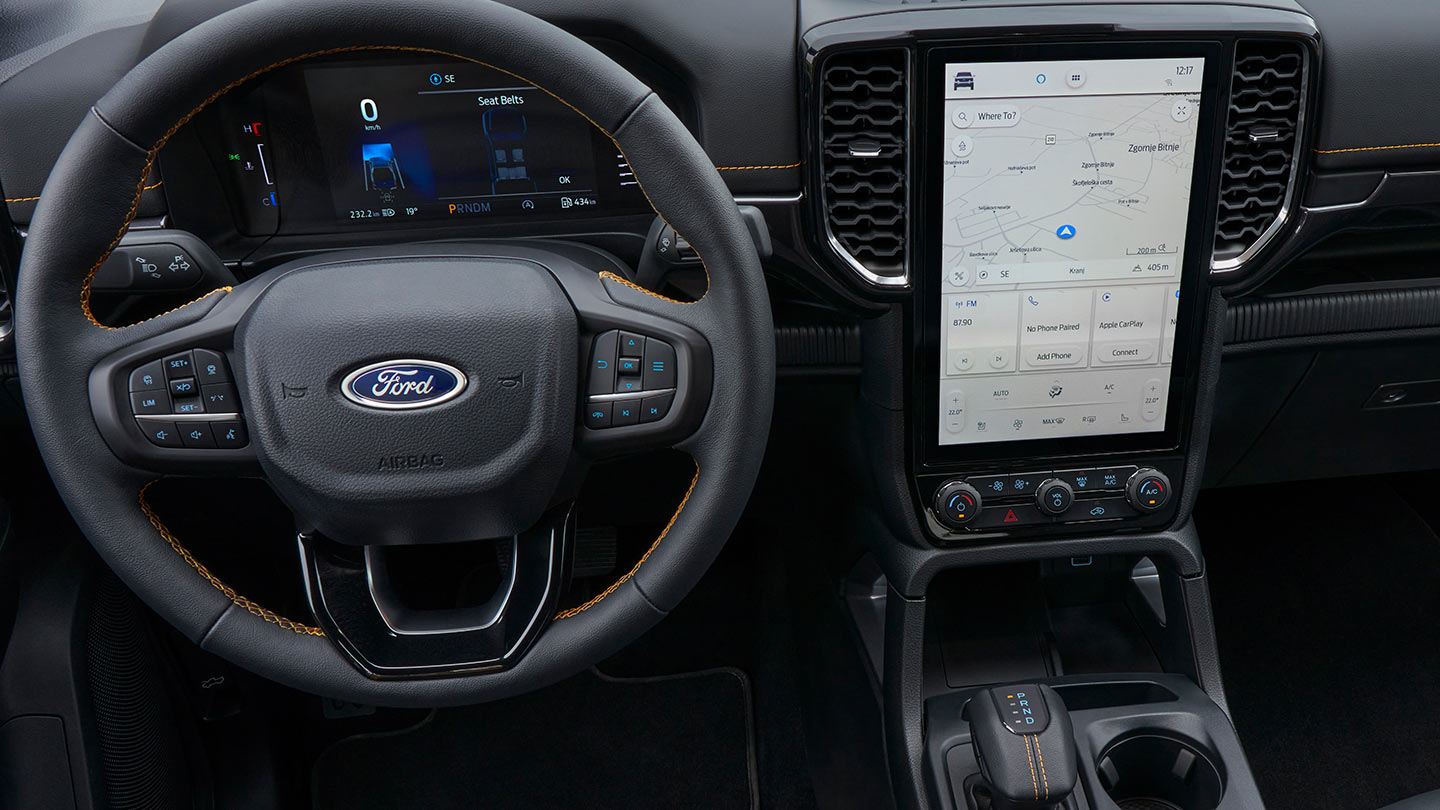 Ford Ranger's steering wheel, digital instrument cluster, and infotainment screen.