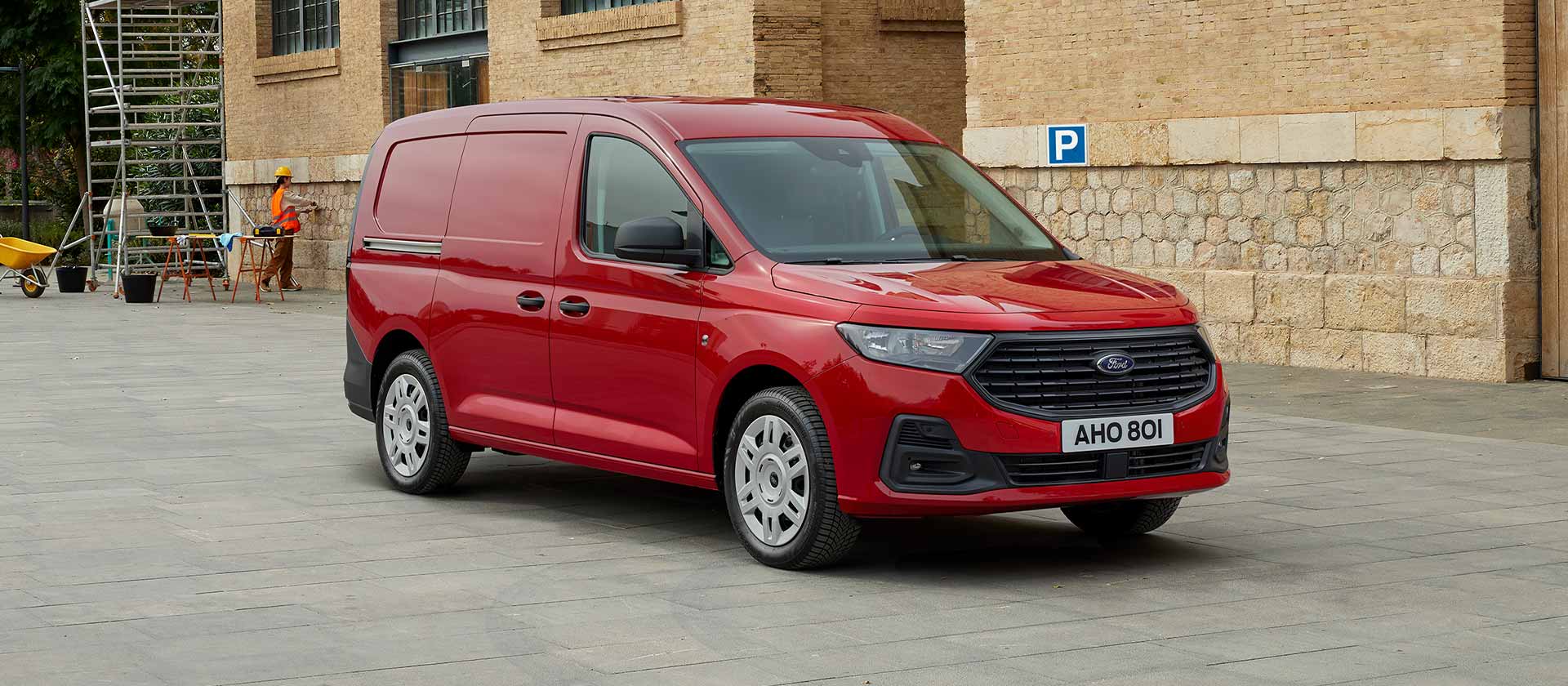 Ford Transit Connect Trend in Lava Red, showing front grille and automatic headlights.
