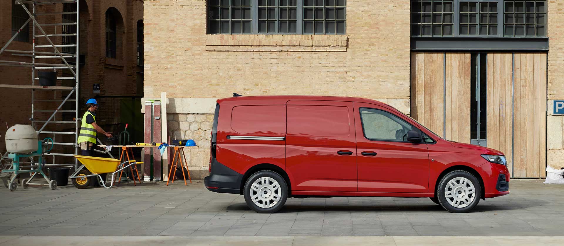 Ford Transit Connect in Lava Red, showing side loading door.