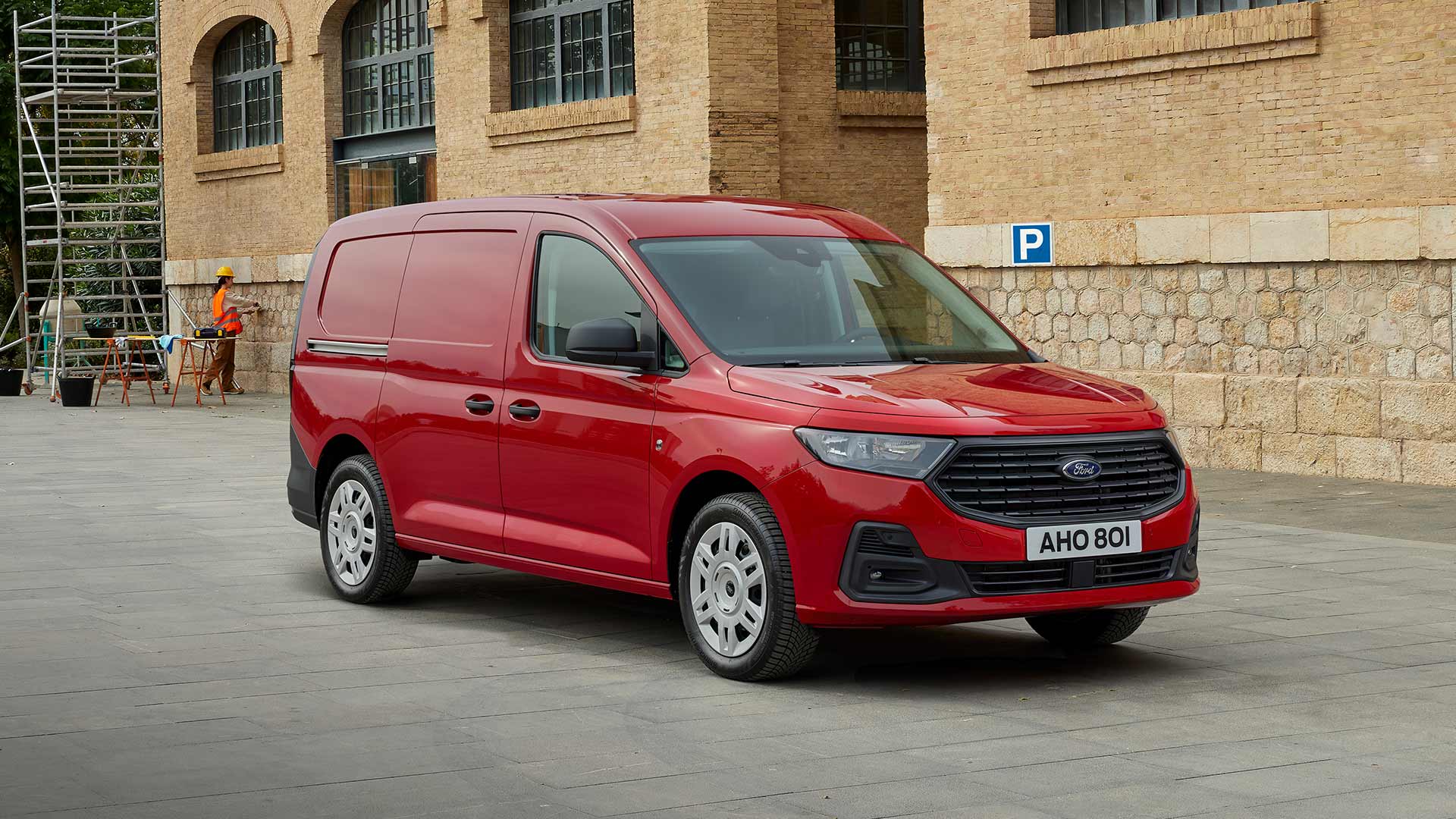 Ford Transit Connect Trend in Lava Red, showing front grille and automatic headlights.