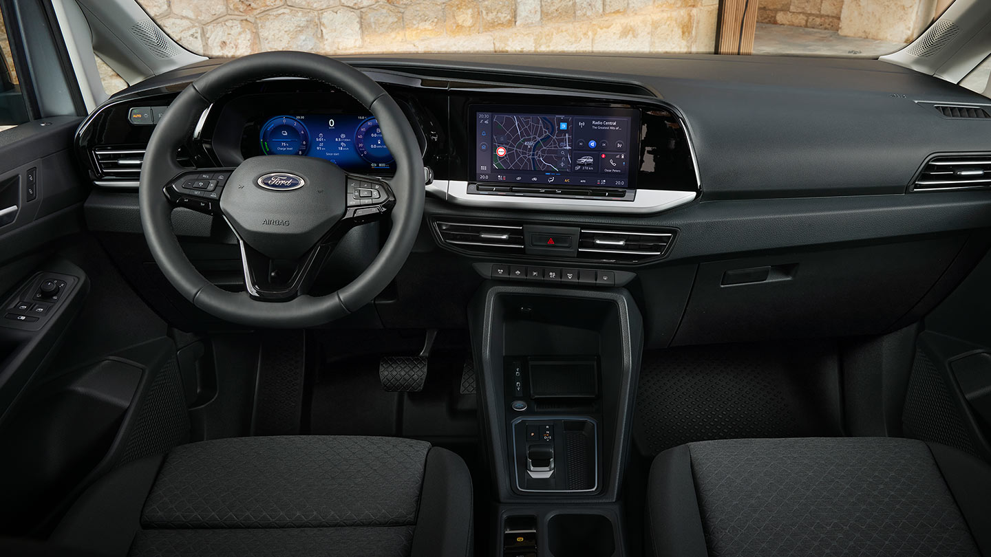Ford Transit Connect interior showing dashboard, steering wheel, digital cluster and 10-inch touchscreen.