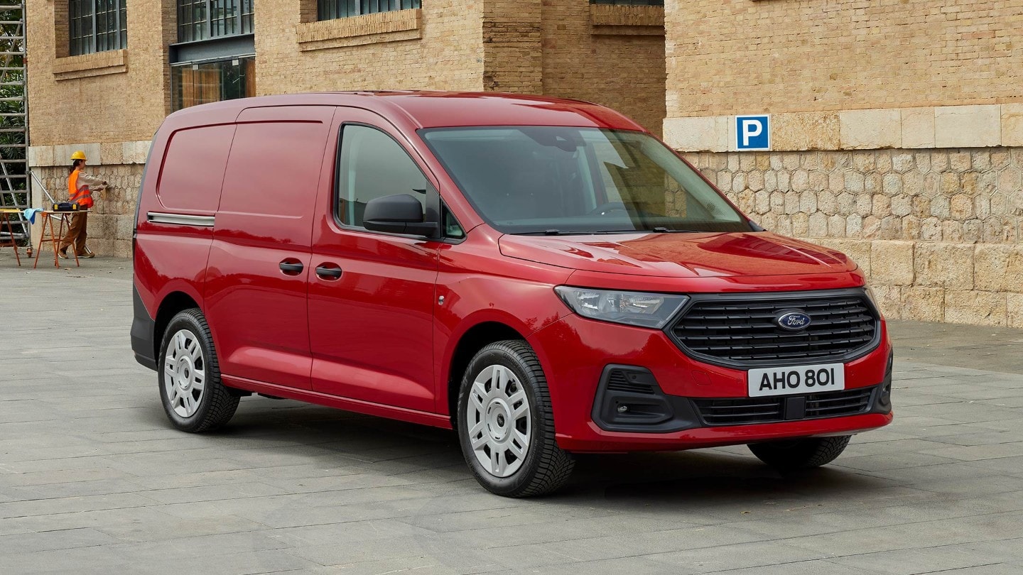 Ford Transit Connect Trend in Maple Red showing front grille and automatic headlights.