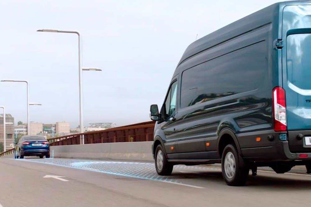 Blue Ford Transit Van with blue lines on road depicting use of Advanced Driver Assistance Systems.