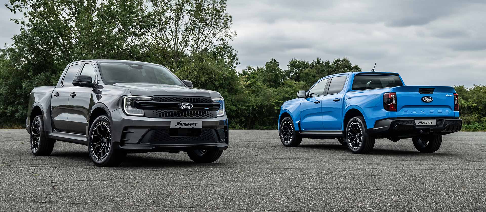 A grey and a blue Ford Ranger MS-RT parked up in antiparallel.