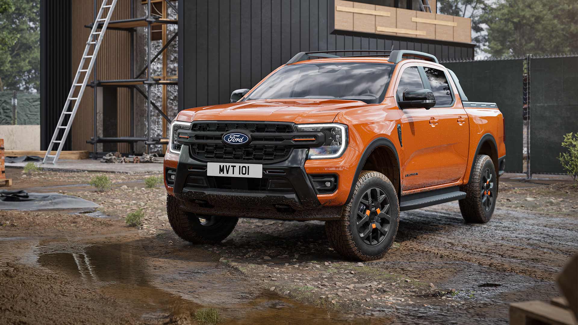 Front view of an orange Ranger Wildtrak X Double Cab parked on a construction site.