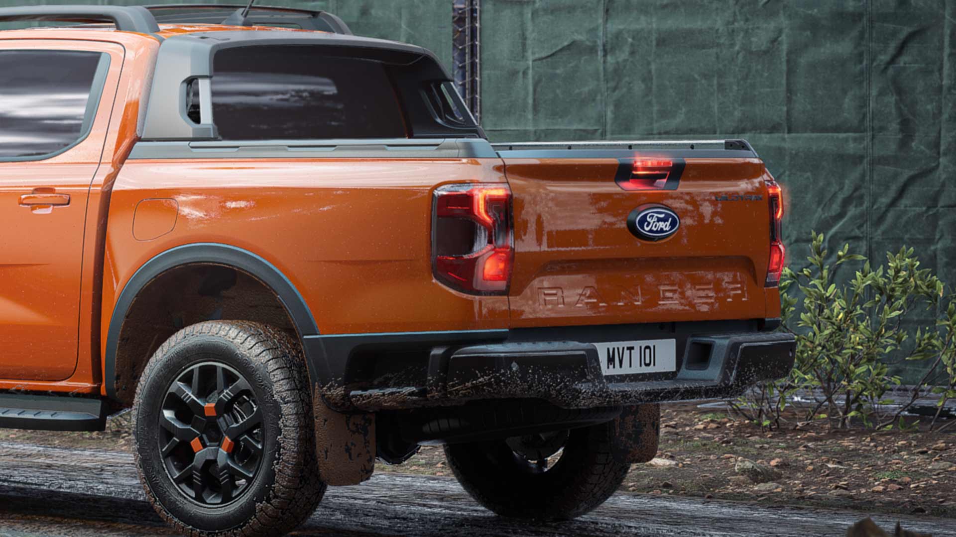 Rear view of an orange Ranger Tremor Double Cab parked on a construction site.
