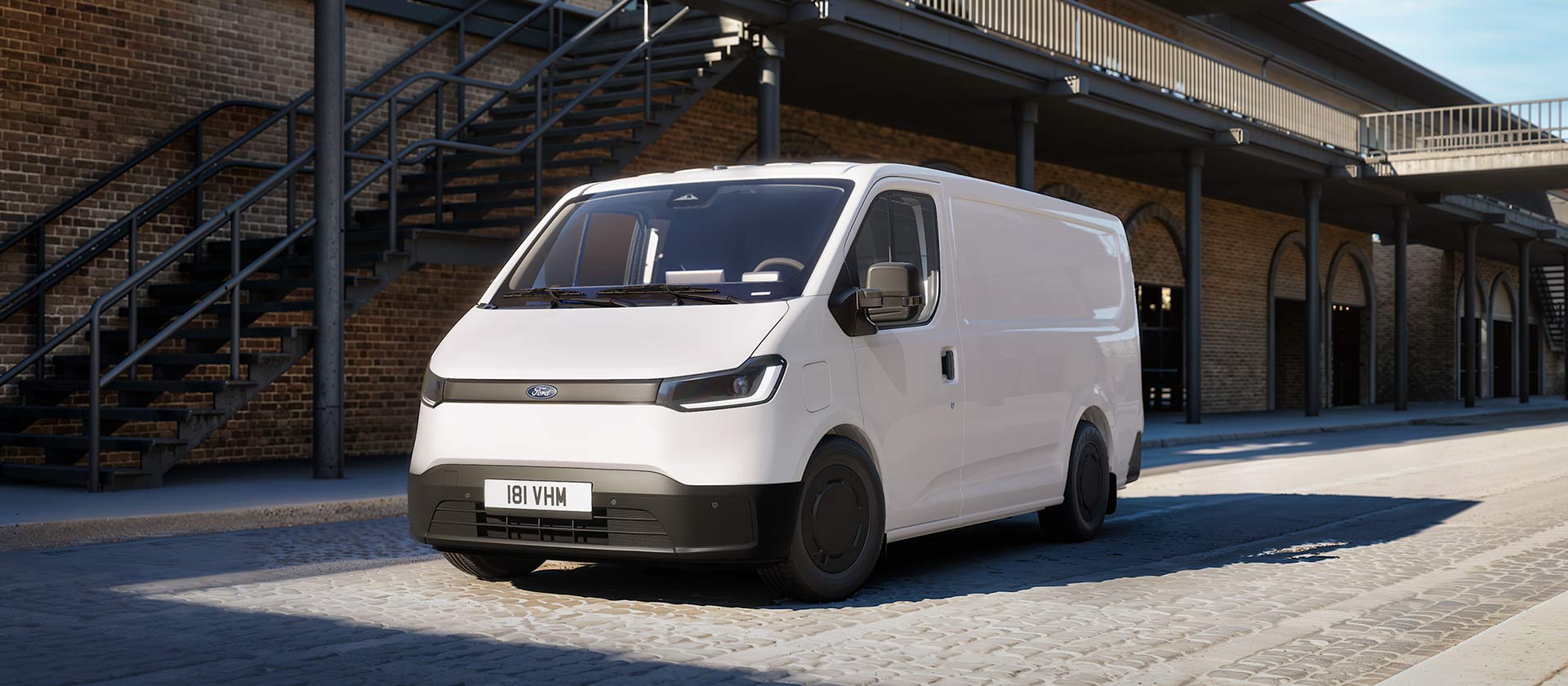 White All-New Ford Transit City L1H1 van parked in in front of a brick building.