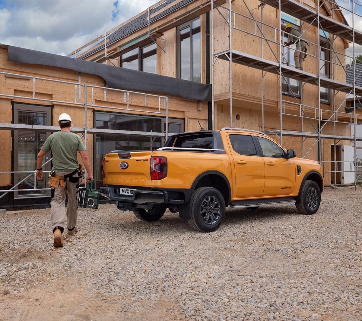 Ford Ranger Wildtrak parked by construction 3/4 rear view