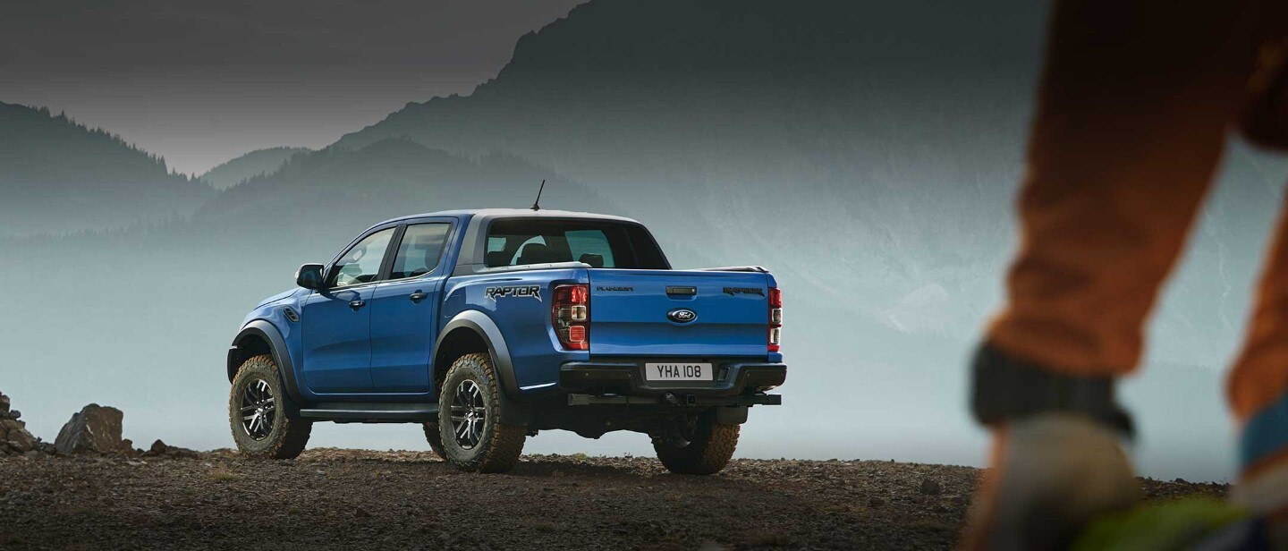 Blue Ford Ranger Raptor parked in the mountains