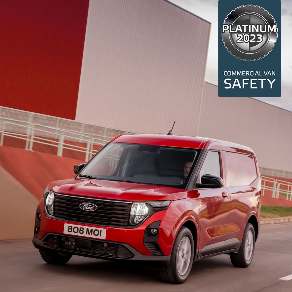 New red Ford Transit Courier Van driving