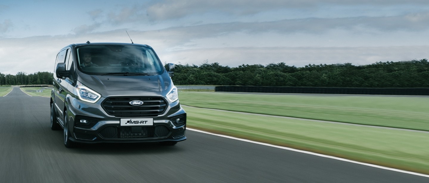 Black Ford Transit Custom MS-RT driving on a racetrack