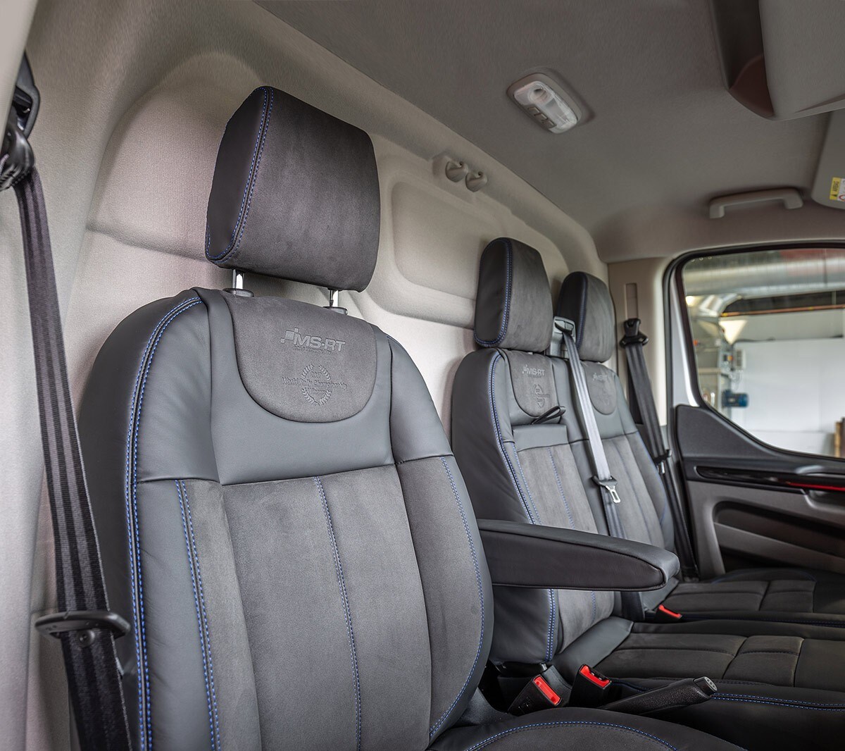 Internal cockpit view of the Ford Transit Custom MS-RT showing the passenger and driver seats