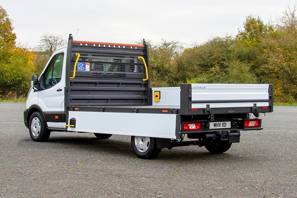 White Ford Pro Chassis Cab parked in a paved lot.