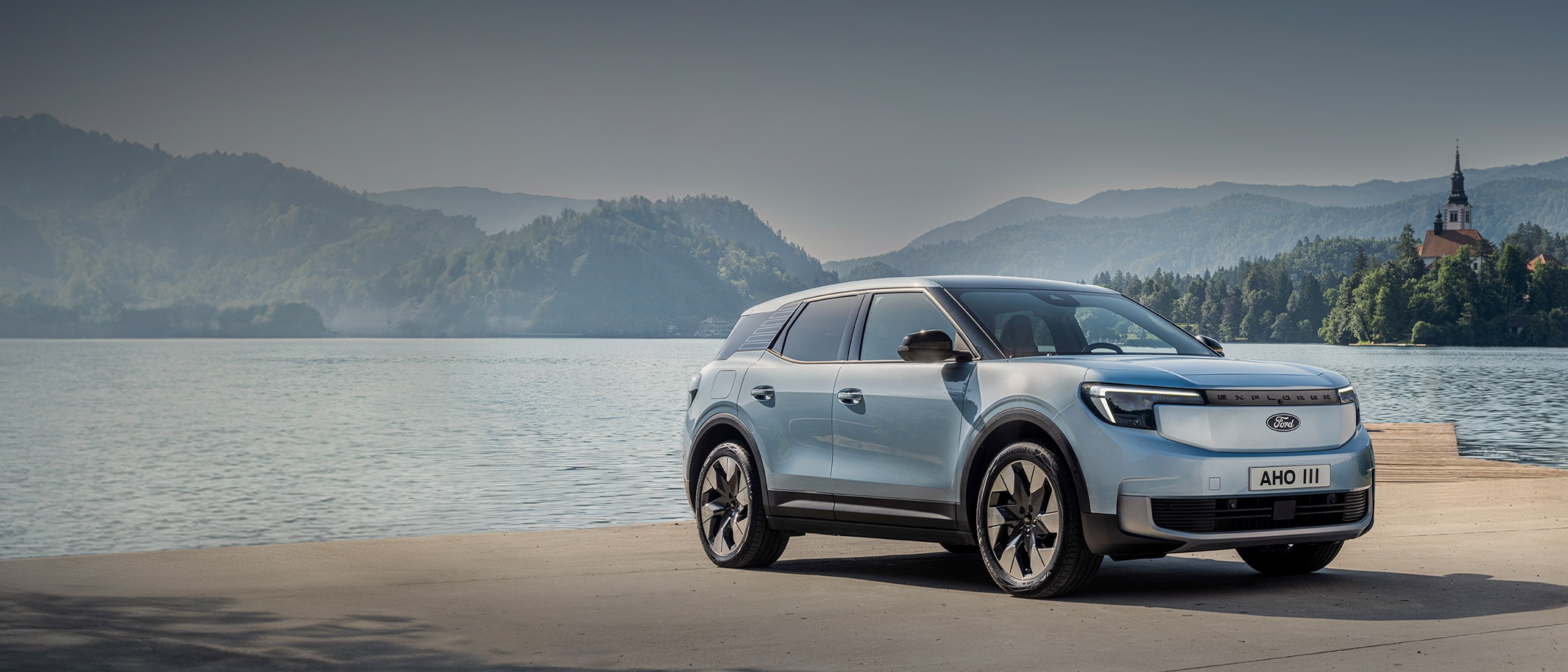 Front view of All-Electric Explorer parked by a lake