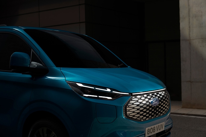 A close up of a blue electric Ford E-Transit Custom van.