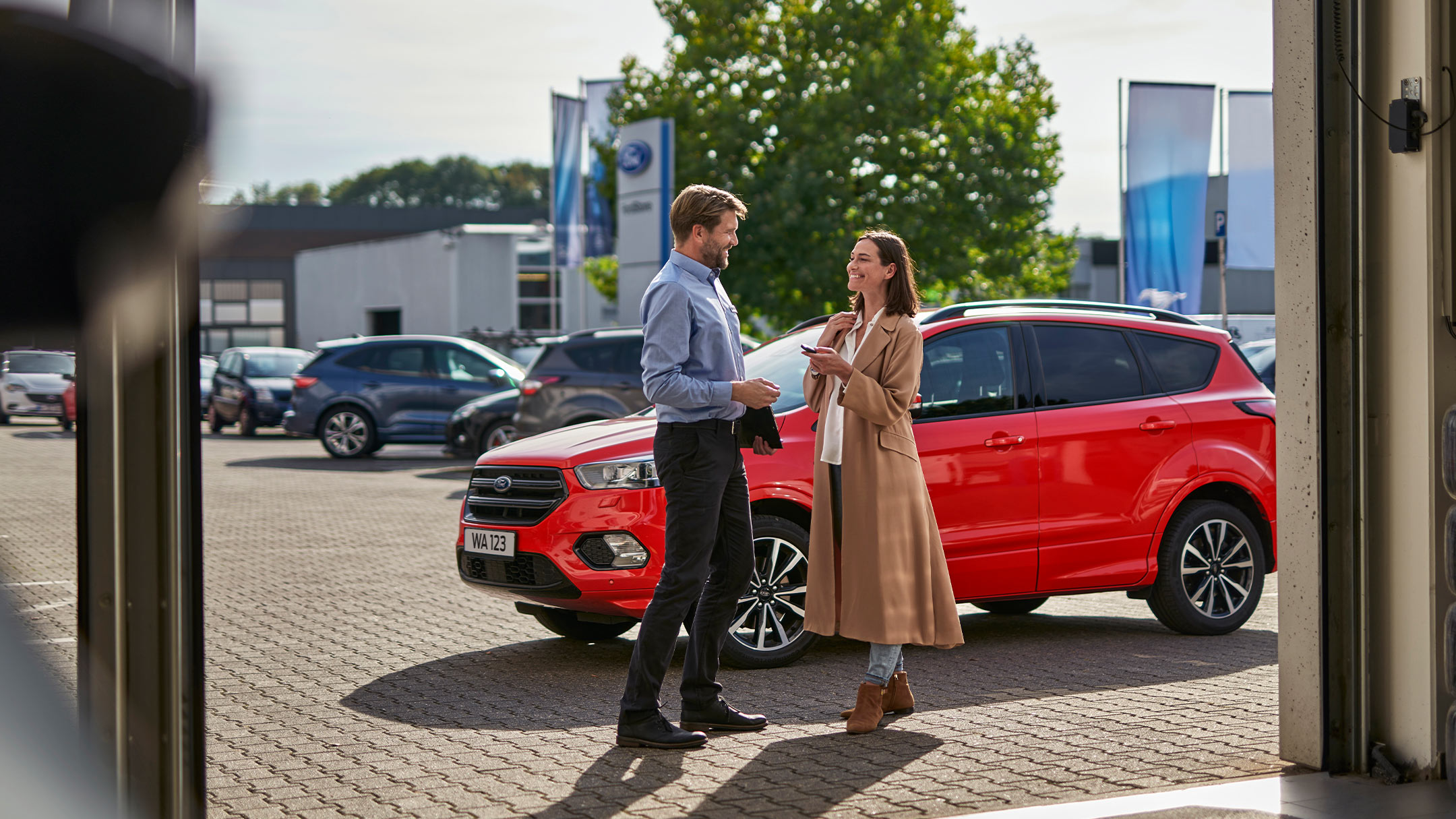 a person speaking to a Ford expert at a Ford service centre.