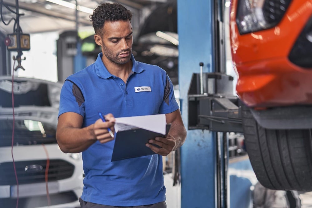  Ford Service engineer, inspecting wheels