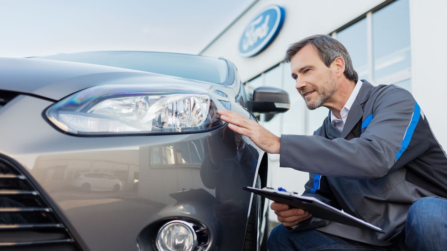 technician checking vehicle