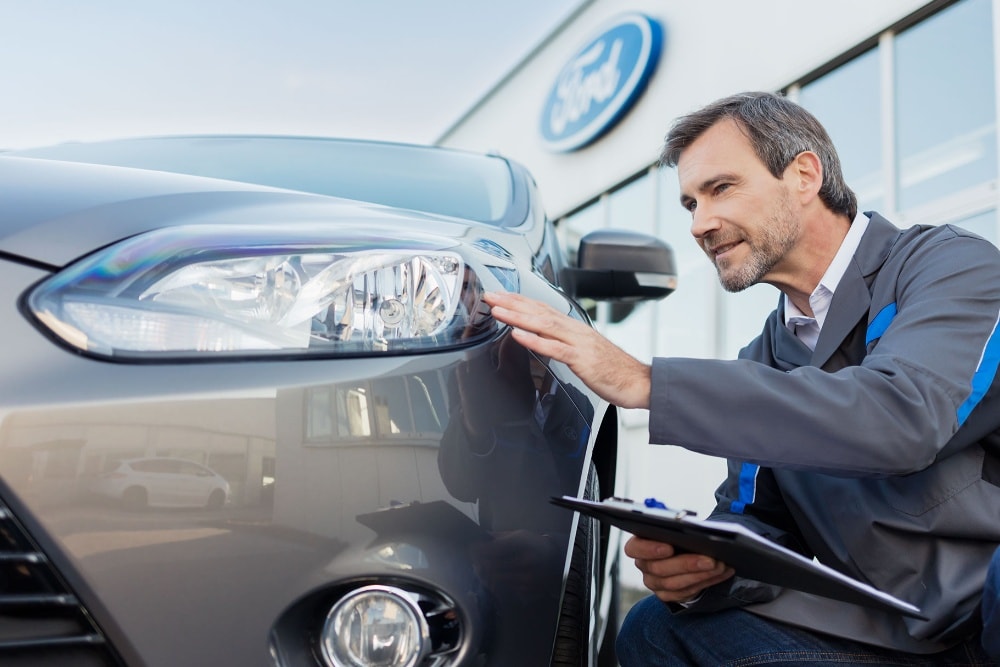 technician checking vehicle