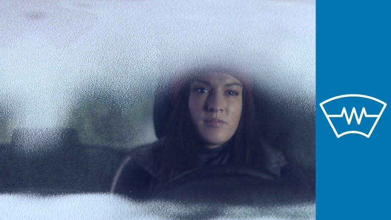 FordPass Connect - woman sitting in a car with frosted up window FordPass Connect - woman sitting in a car with frosted up window