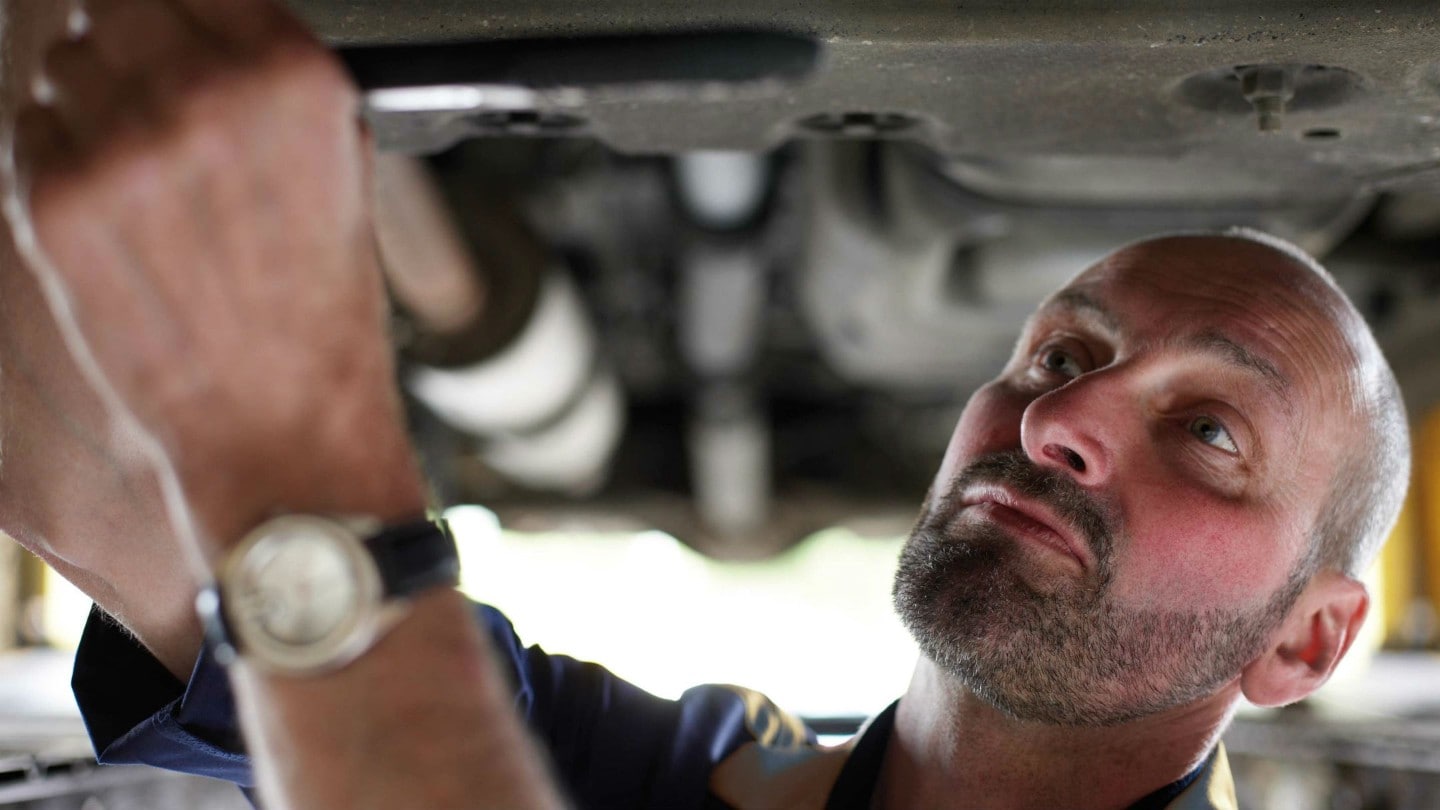 Ford technician repairing a car