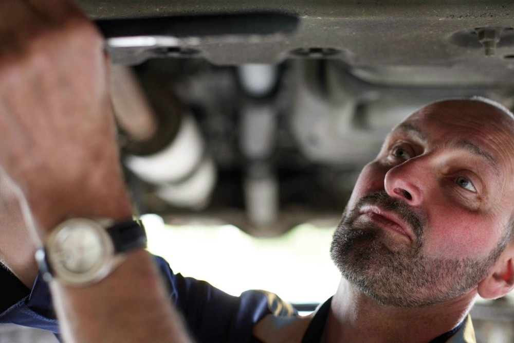 Ford technician repairing a car