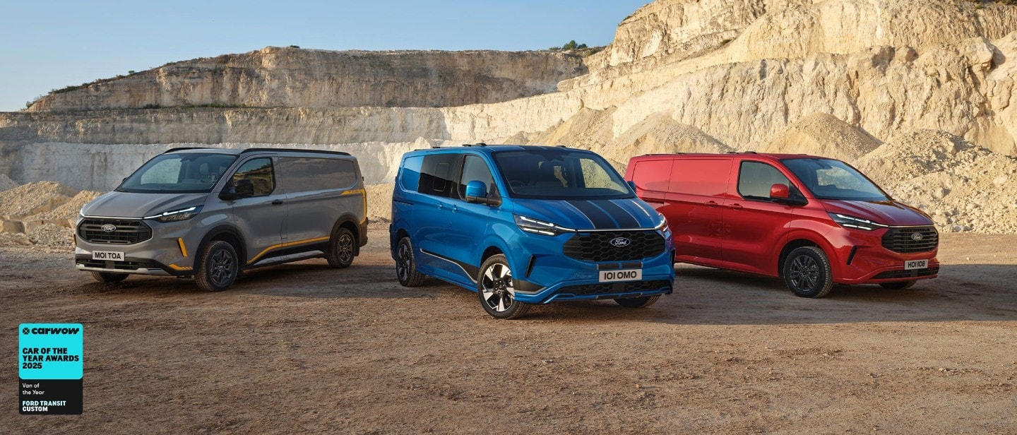 Three Ford Transit Custom Vans in grey, blue and red, parked side by side