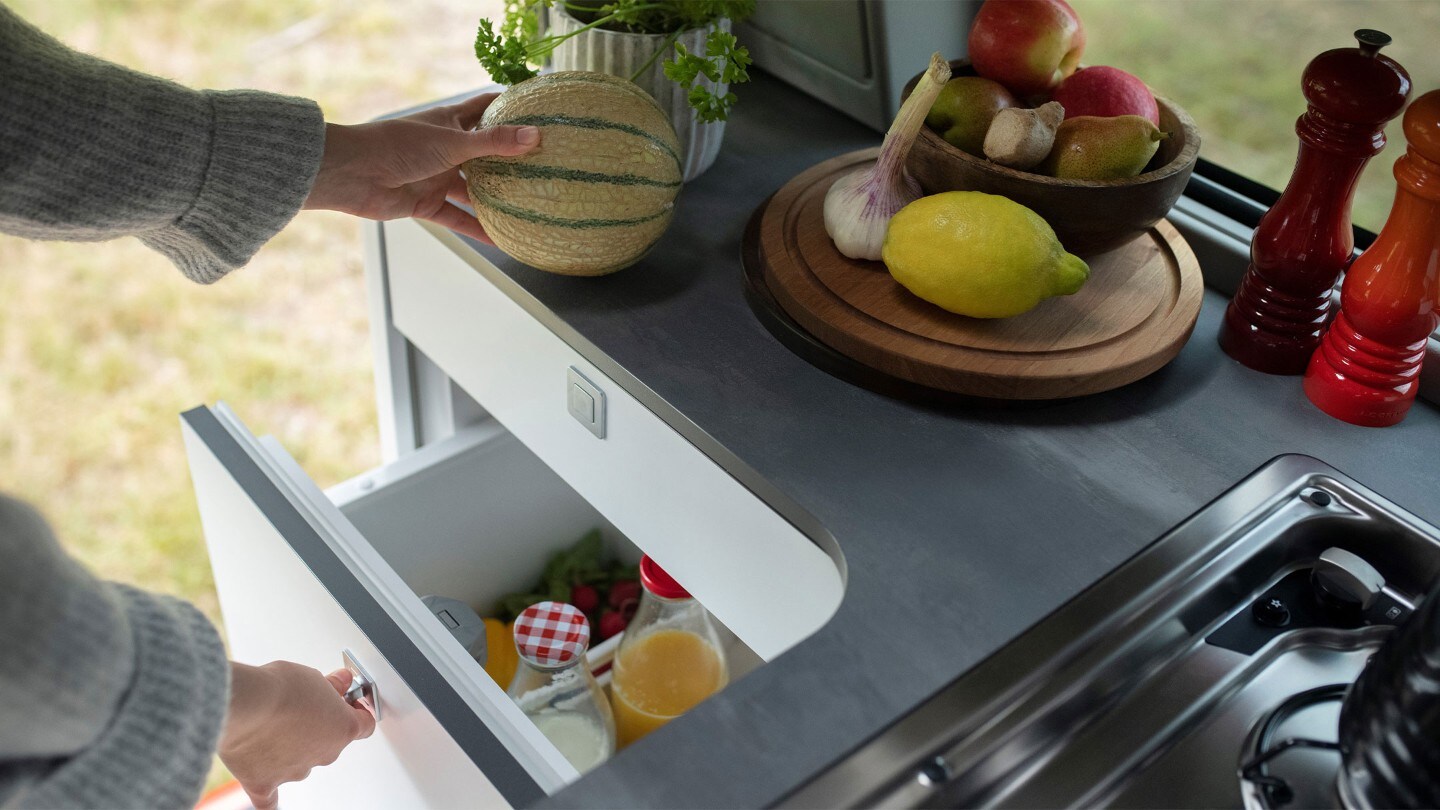 Someone opening the new drawer-style fridge in the Nugget kitchen.