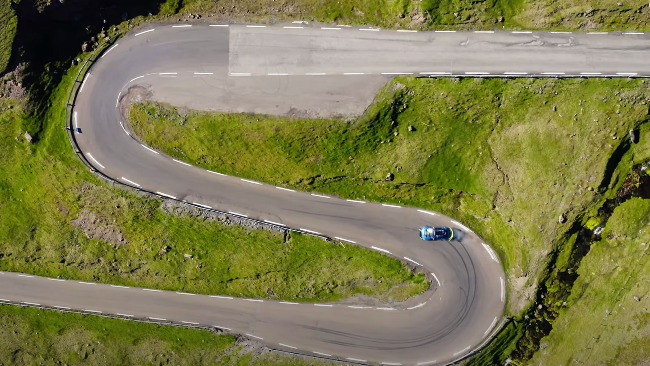 Spiral mountain road from bird's eye view