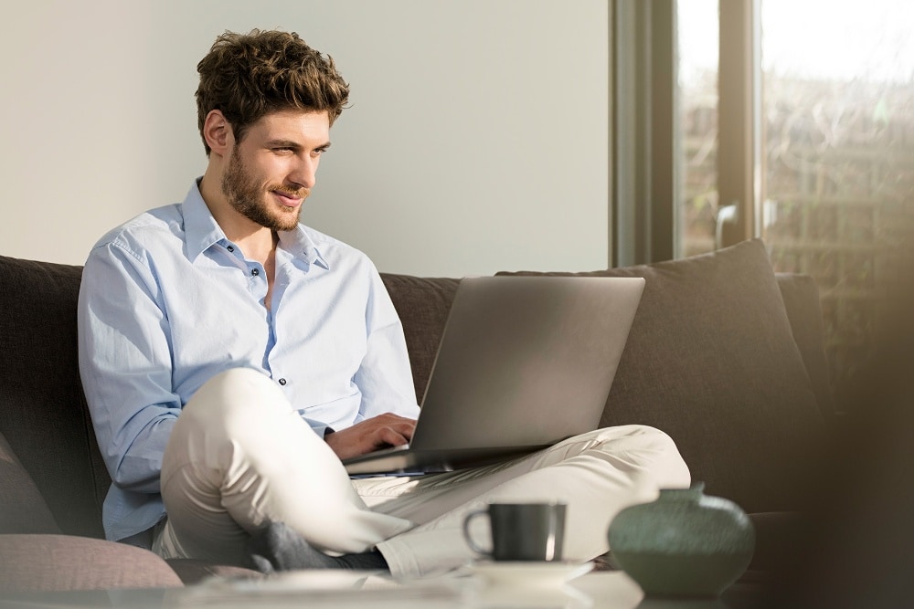 Man booking an online service booking on his laptop