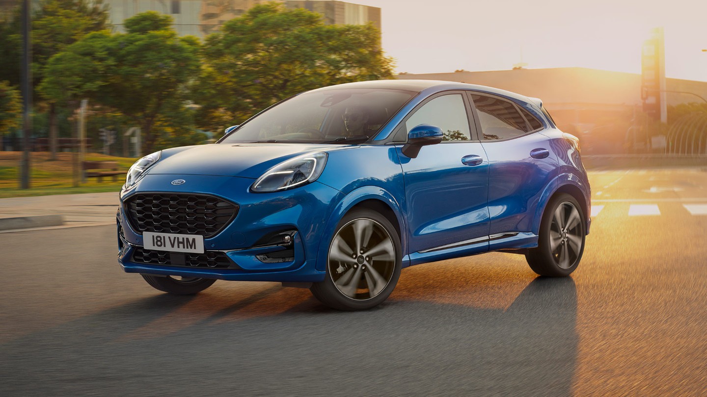 Ford Puma in blue parked on a road in sunset